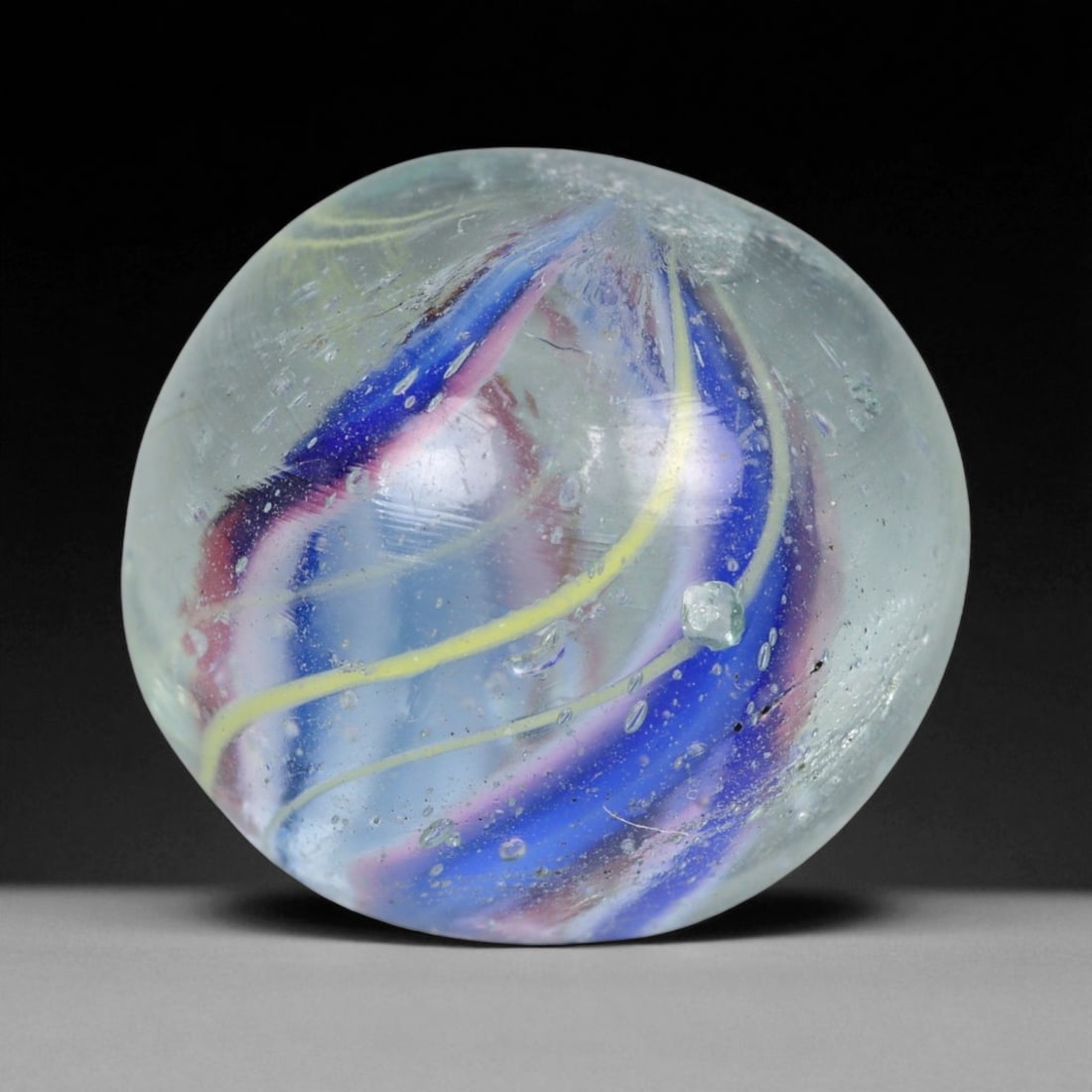 Vintage German Handmade Glass Swirl Marble, c. Early-Mid 20th Century, 16 mm: This vintage German handmade glass marble represents the golden era of European glass artistry, where precision craftsmanship and vibrant color blending elevated even simple play objects into collecti