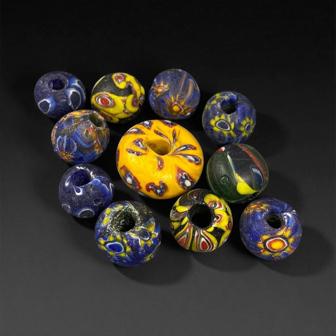 Antique Venetian Polychrome Millefiori and Chevron Glass Beads, c. 19th Century, 1.4-2.3cm: This lively assemblage of antique Venetian glass beads, dating from the 19th century, captures the exuberant color and artistry that made Murano glassmakers the undisputed masters of decorative beadwo