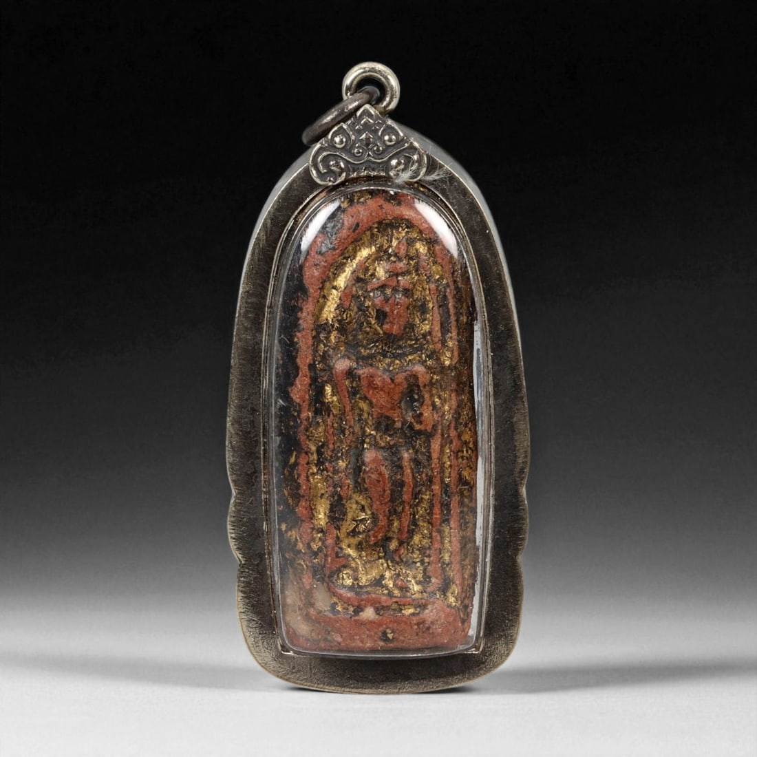 Vintage Thai Buddhist Amulet in Ornate Framed Setting, 20th Century, 6cm: This vintage Thai Buddhist amulet exemplifies the devotional artistry that continues to define Thailand's sacred craftsmanship. Encased within an intricately detailed frame, the amulet displays refine