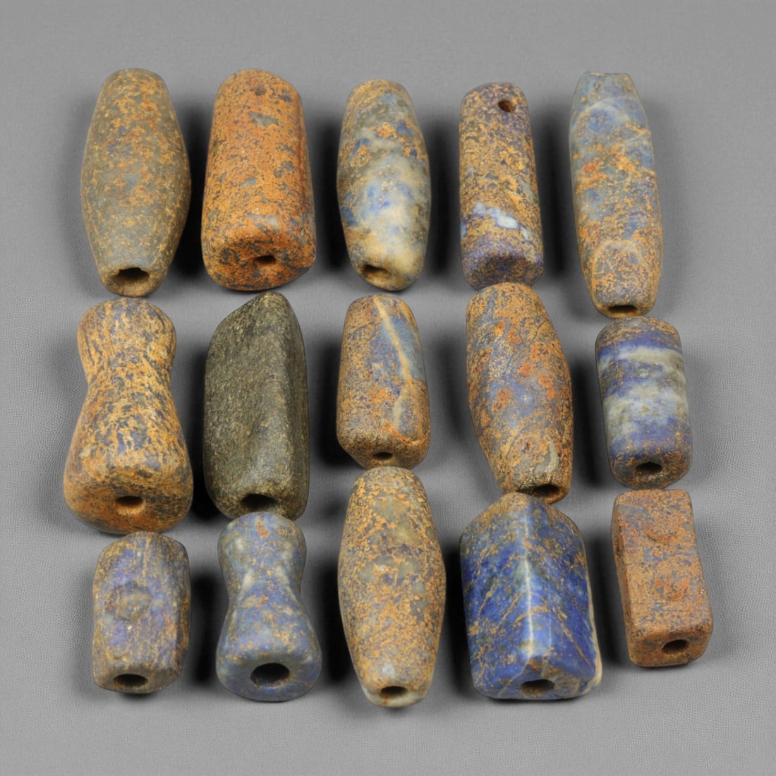 Ancient Bactrian Lapis Lazuli Beads, c. 2nd Millennium BCE, 1.3-2cm: These ancient Bactrian lapis lazuli beads, dating to approximately the 2nd millennium BCE, stand as remarkable relics of one of history's earliest centers of trade and craftsmanship. Sourced from the 