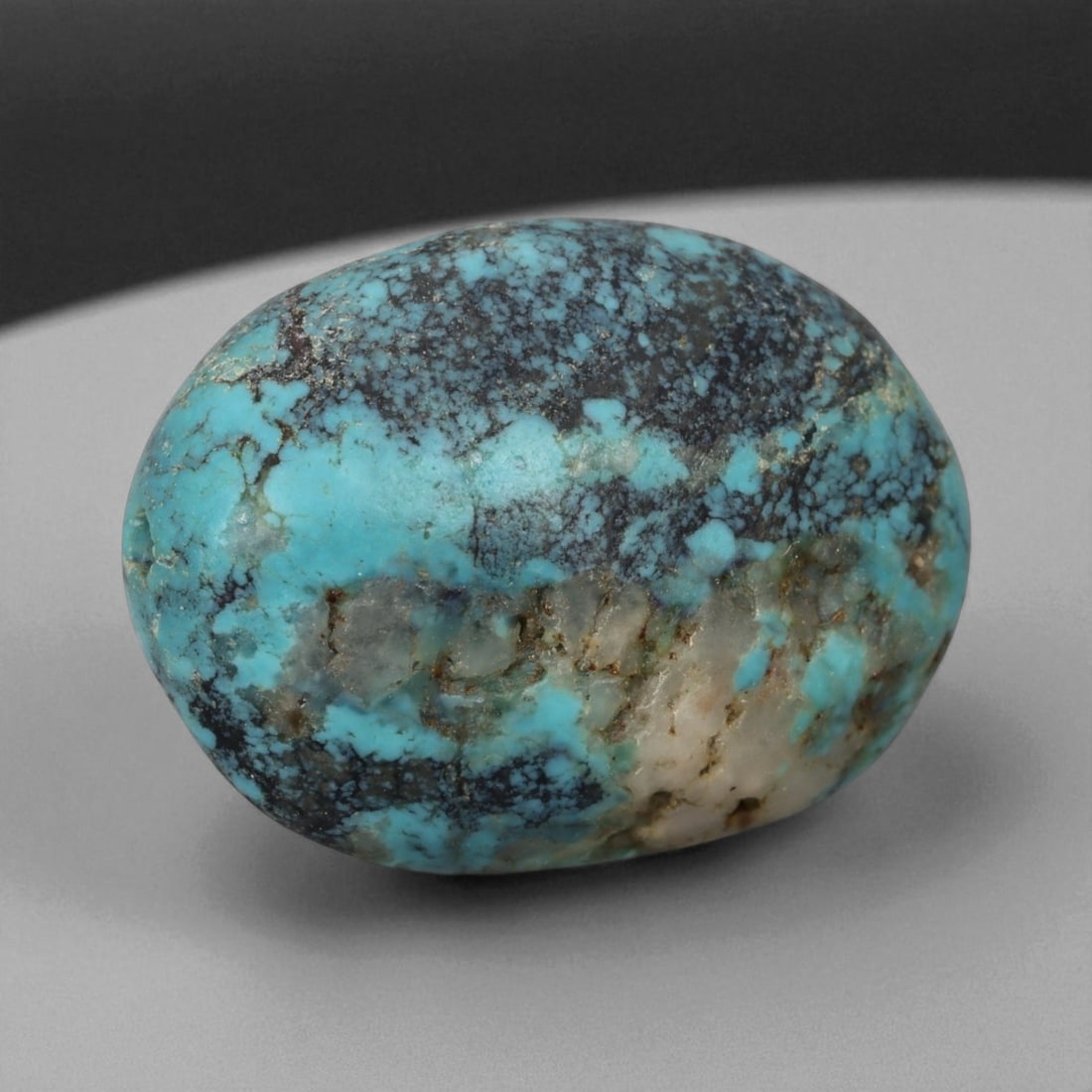 Antique Tibetan Mala Prayer Turquoise Amulet Bead, c. 18th-19th Century, 2.1cm, 5g: This striking turquoise bead from Tibet, dating to the 18th-19th century, embodies the deep spiritual and cultural reverence accorded to this precious stone in Himalayan tradition. Its organic, rounde