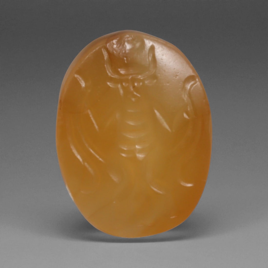 Ancient Sasanian Carnelian Intaglio with Engraving Motif, 1.6cm, 3g: This carnelian intaglio, finely engraved into the warm red tones of semi-precious stone, reflects a tradition of craftsmanship spanning from the classical world to the early modern era. Intaglios serv