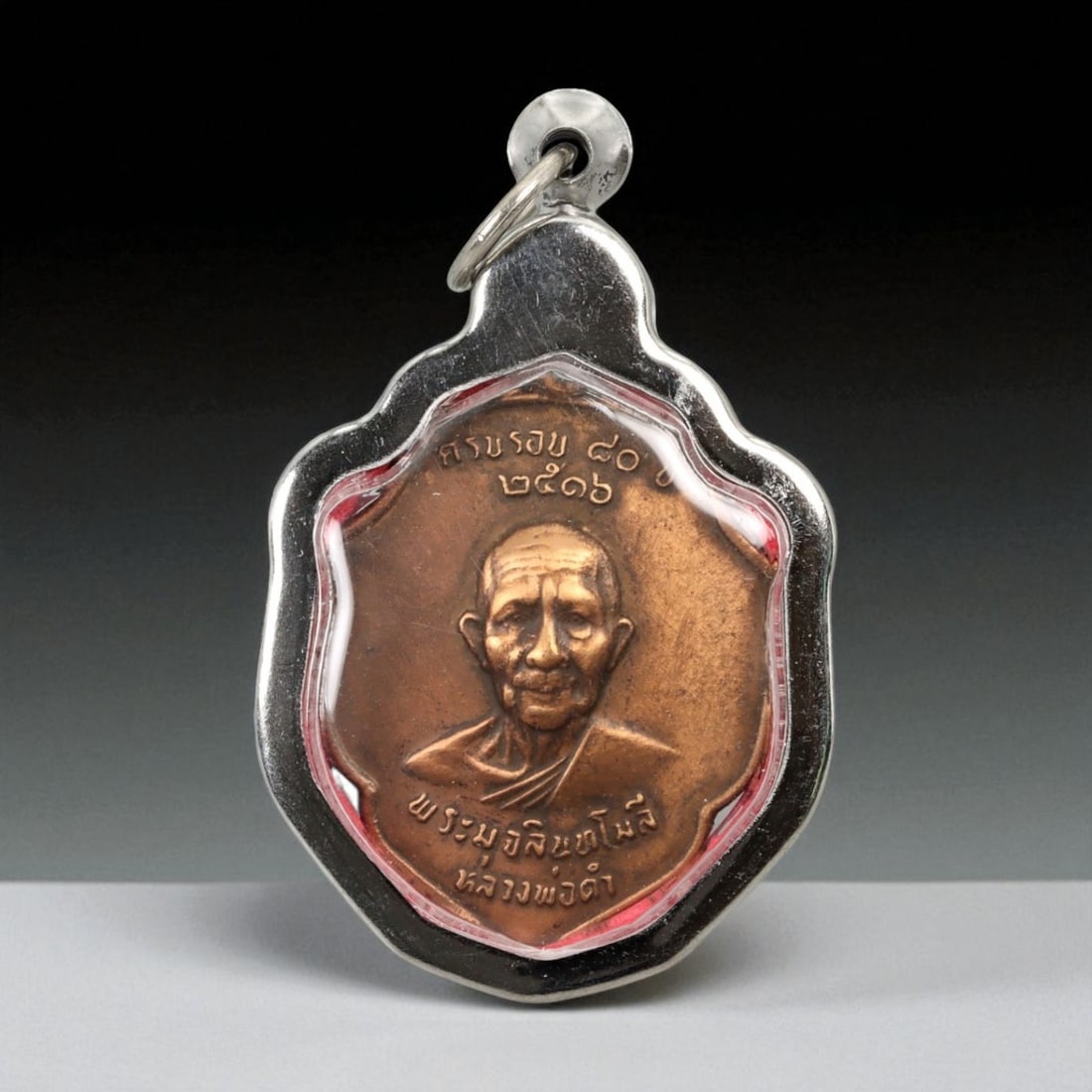 Vintage Thai Buddhist Amulet in Ornate Framed Setting, 20th Century, 5cm: This vintage Thai Buddhist amulet exemplifies the devotional artistry that continues to define Thailand's sacred craftsmanship. Encased within an intricately detailed frame, the amulet displays refine