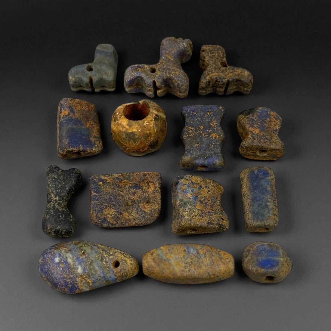 Ancient Bactrian Lapis Lazuli Beads, c. 2nd Millennium BCE, 1-2cm: These ancient lapis lazuli beads originate from the region once known as Bactria, located in present-day northern Afghanistan - a civilization renowned for its early mastery of gemstone craftsmanship 