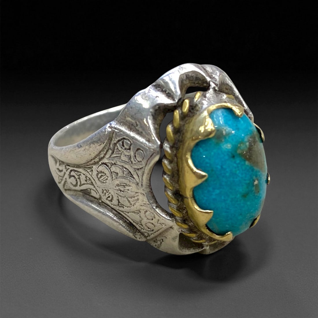 Antique Persian Gilded Floral Turquoise Silver Ring, c. 19th-20th Century, US 10.5, 8g: This refined antique Persian silver ring reflects the elegant artistry of late Qajar-era silversmiths, where beauty and symbolism merged seamlessly. At its center lies a vivid turquoise cabochon, beze