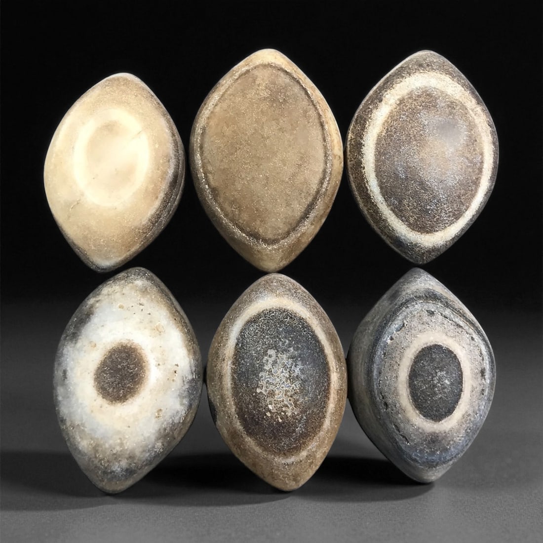 Ancient Medieval Tibetan Luk Mik "Goat's Eye" Agate Beads, c. 11th-14th Century CE, 2.5-2.9 cm: This striking collection of ancient medieval Luk Mik "Goat's Eye" agate beads dates to the 11th-14th century CE, during the late Tibetan Buddhist period influenced by the flourishing trade along the S