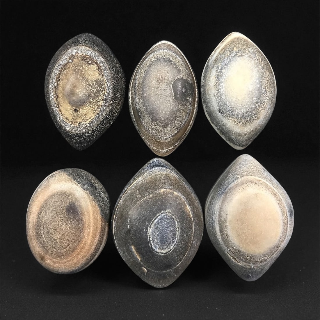 Ancient Medieval Tibetan Luk Mik "Goat's Eye" Agate Beads, c. 11th-14th Century CE, 2.3-2.6 cm: This striking collection of ancient medieval Luk Mik "Goat's Eye" agate beads dates to the 11th-14th century CE, during the late Tibetan Buddhist period influenced by the flourishing trade along the S