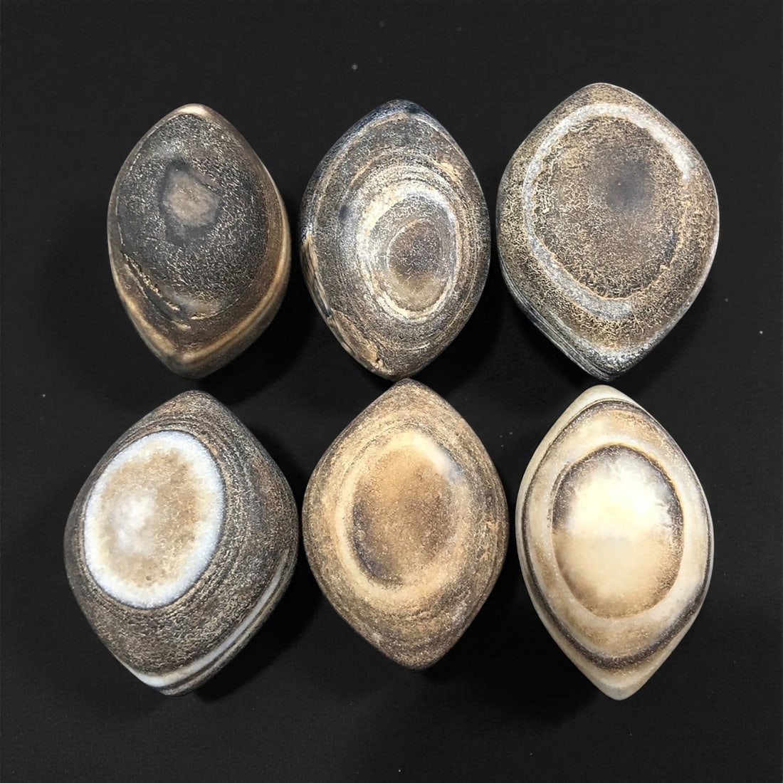 Ancient Medieval Tibetan Luk Mik "Goat's Eye" Agate Beads, c. 11th-14th Century CE, 2.5-2.9 cm: This striking collection of ancient medieval Luk Mik "Goat's Eye" agate beads dates to the 11th-14th century CE, during the late Tibetan Buddhist period influenced by the flourishing trade along the S