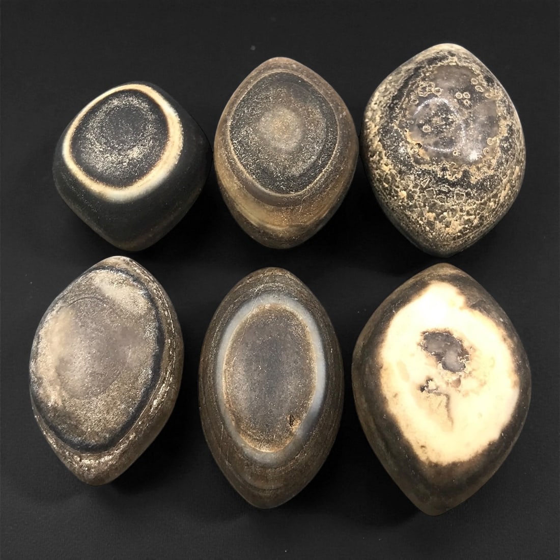Ancient Medieval Tibetan Luk Mik "Goat's Eye" Agate Beads, c. 11th-14th Century CE, 2.5-3.2 cm: This striking collection of ancient medieval Luk Mik "Goat's Eye" agate beads dates to the 11th-14th century CE, during the late Tibetan Buddhist period influenced by the flourishing trade along the S