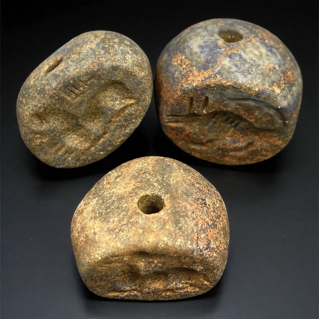 Ancient Akkadian Hemispherical Lapis Stamp Seals, c. 23rd-21st Century BCE, 1.8-1.9 cm: These three hemispherical stone stamp seals date from the Akkadian Empire, the first unified Mesopotamian state (c. 23rd-21st century BCE). Crafted from lapis lazuli and steatite, they embody the admi