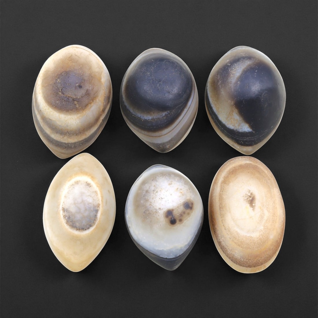Ancient Medieval Tibetan Luk Mik "Goat's Eye" Agate Beads, c. 11th-14th Century CE, 2.5-2.7cm: This striking collection of ancient medieval Luk Mik "Goat's Eye" agate beads dates to the 11th-14th century CE, during the late Tibetan Buddhist period influenced by the flourishing trade along the S