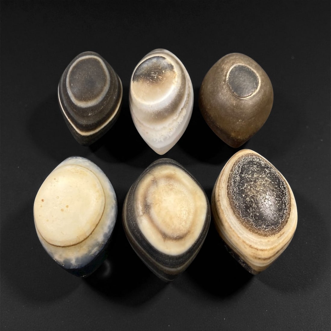 Ancient Medieval Tibetan Luk Mik "Goat's Eye" Agate Beads, c. 11th-14th Century CE, 2.7-3.2cm: This striking collection of ancient medieval Luk Mik "Goat's Eye" agate beads dates to the 11th-14th century CE, during the late Tibetan Buddhist period influenced by the flourishing trade along the S
