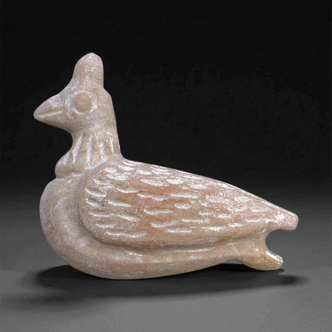 Ancient Near Eastern Bird Effigy Stone Amulet, c. 2nd Millennium BCE, 7cm, 61g: This gracefully carved bird effigy amulet, hewn from smooth beige-toned stone, originates from the ancient Near East and dates to the 2nd millennium BCE. Birds were widely revered in early Mesopotamia
