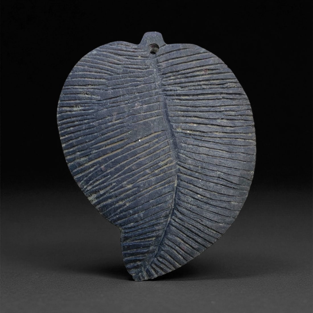 Ancient Gandharan Sacred Leaf-Shaped Schist Pendant, c. 2nd-4th Century CE, 10cm, 96g: This elegantly carved leaf-shaped pendant originates from the ancient Gandharan region, a cultural crossroads in what is now northern Pakistan and eastern Afghanistan. Dated to the 2nd-4th century CE,