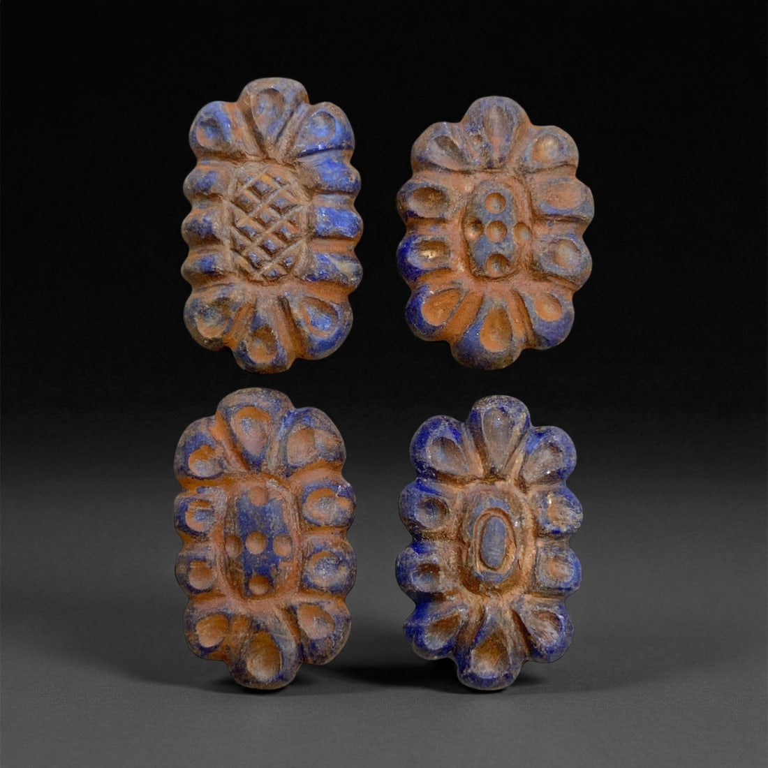 Ancient Achaemenid Lapis Lazuli Floral Beads (Set of 4), c. 6th-4th Century BCE, 2cm, 31g: This matched set of four lapis lazuli floral beads is a radiant example of Achaemenid imperial luxury and symbolic artistry, dating to the 6th-4th century BCE. Skillfully carved from deep blue lapis w