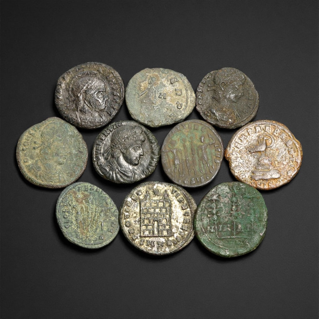 Ancient Roman Imperial Bronze Coins (AE2-AE3 Denominations), c. 3rd-4th Century CE: A well-preserved group of nine bronze coins dating from the late Roman Imperial era, spanning approximately the 3rd to 4th century CE. These AE2-AE3 denominations represent a dynamic period of transit