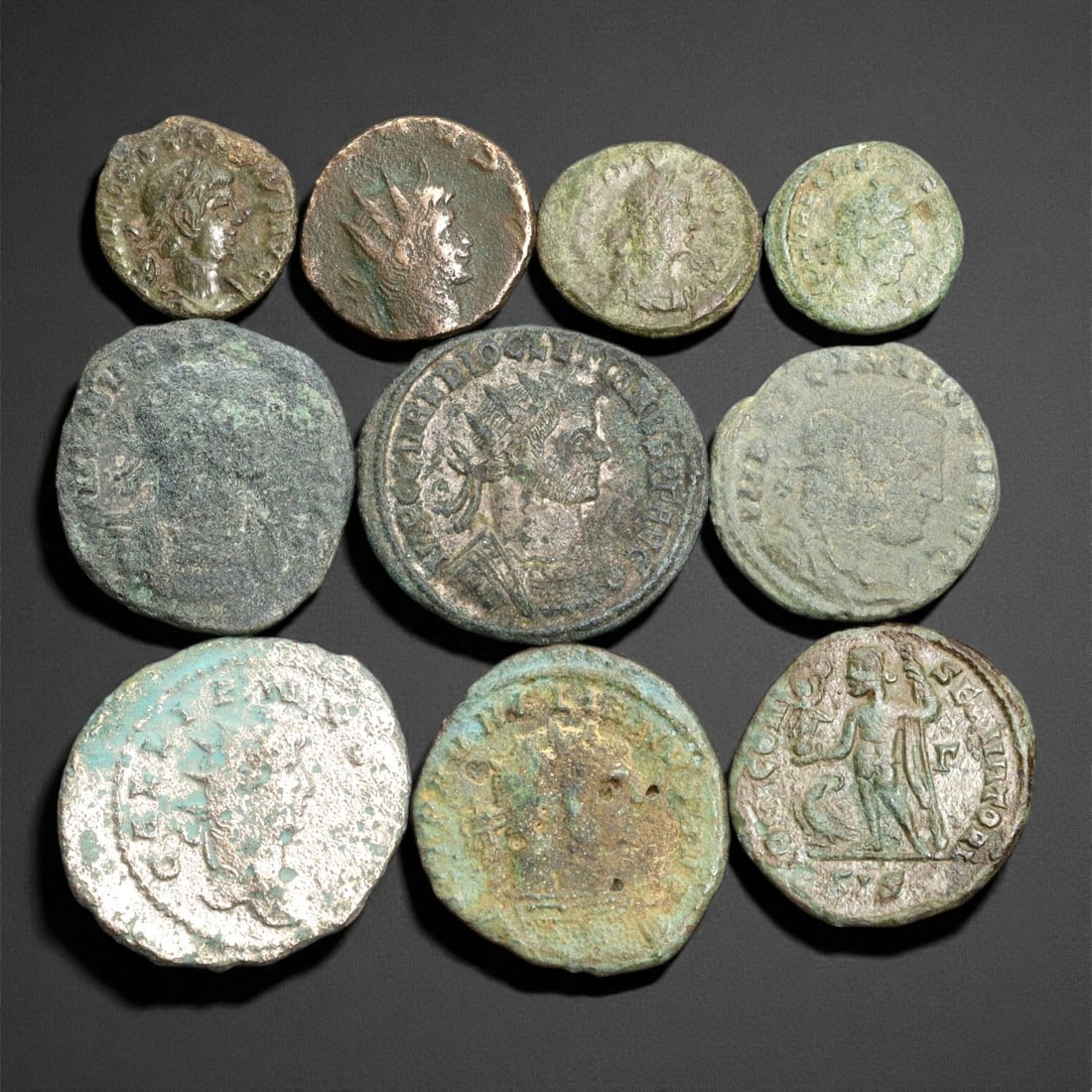 Ancient Roman Imperial Bronze Coins (AE2-AE3 Denominations), c. 3rd-4th Century CE: A well-preserved group of nine bronze coins dating from the late Roman Imperial era, spanning approximately the 3rd to 4th century CE. These AE2-AE3 denominations represent a dynamic period of transit