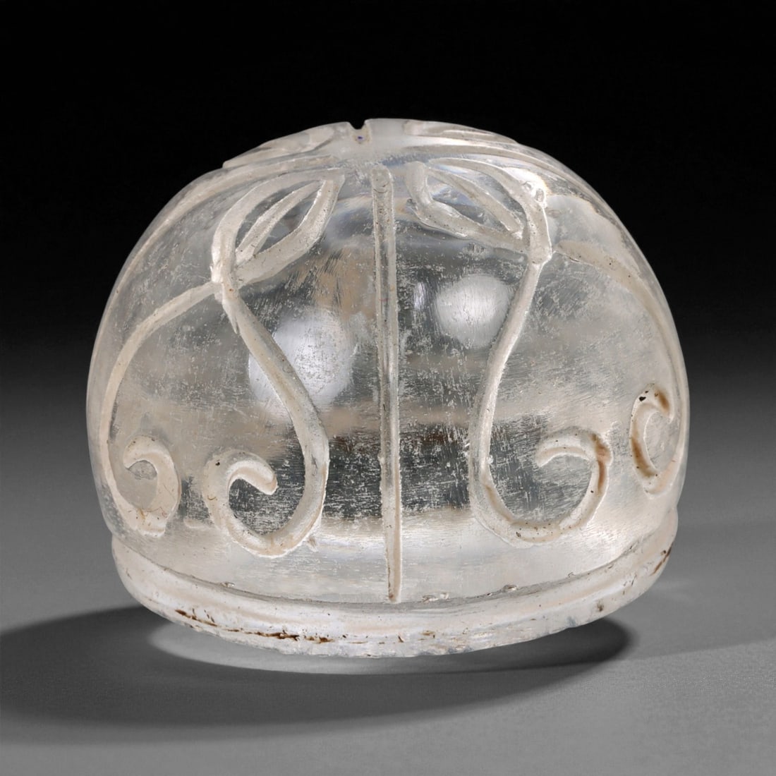 Ancient Medieval Coptic Egyptian Glass Chess Piece, c. 10th-12th Century CE, 3.5cm: This refined domed glass piece, measuring 3.5 cm in height, dates to the Coptic Egyptian period of the Medieval era, circa 10th-12th century CE. Expertly carved from translucent glass with faint iride