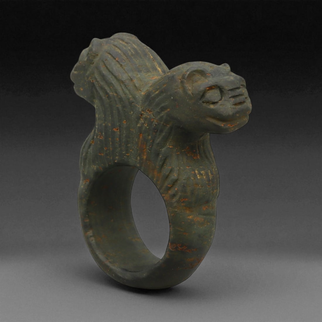 Ancient Mesopotamian Double-Lion Steatite Ring, c. 2nd Millennium BCE, 4.4 cm: This powerful stone ring, sculpted in steatite with twin lion heads, originates from the cultural heartlands of ancient Mesopotamia during the 2nd millennium BCE-a period marked by the flourishing of 