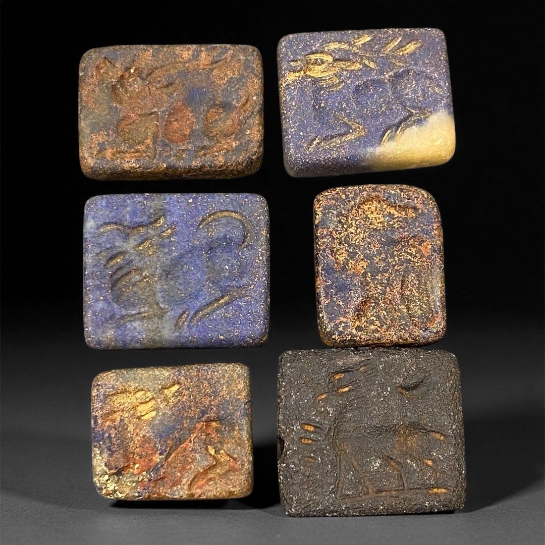 Ancient Near Eastern Lapis Lazuli Animal Stamp Seals, c. 2200-1800 BCE 1.5-1.8cm: This remarkable lot of six ancient stamp seals, carved from vibrant lapis lazuli, dates to the Late Akkadian or early Old Babylonian period, c. 2200-1800 BCE. These seals exemplify the refined craftsm