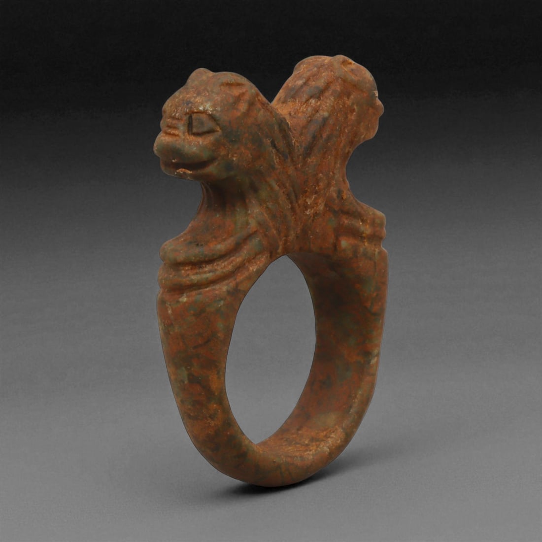 Ancient Mesopotamian Double-Lion Steatite Ring, c. 2nd Millennium BCE, 4.3 cm: This powerful stone ring, sculpted in steatite with twin lion heads, originates from the cultural heartlands of ancient Mesopotamia during the 2nd millennium BCE-a period marked by the flourishing of 
