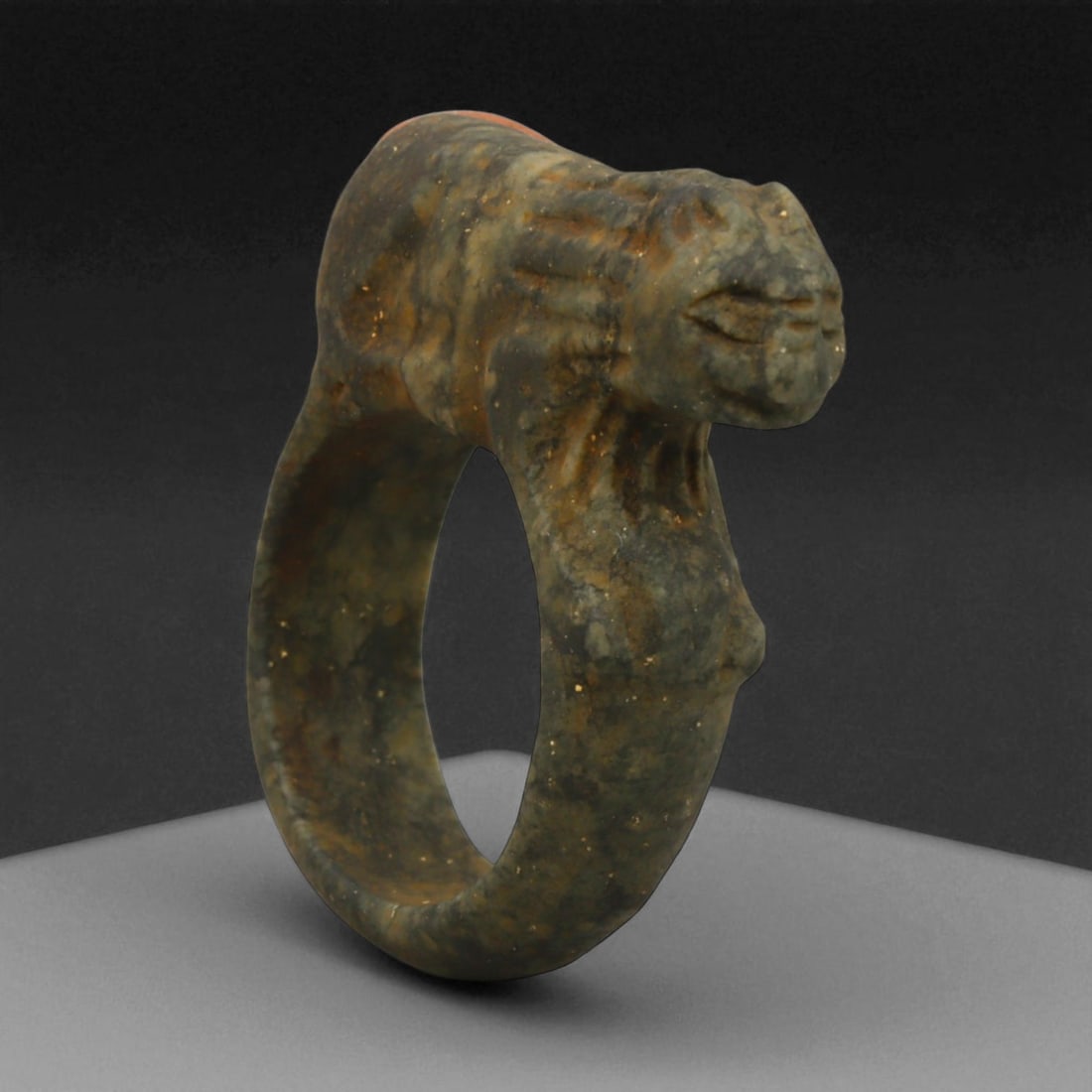 Ancient Parthian Lion-Form Steatite Ring, c. 2nd-1st Century BCE, 3.9 cm: This striking ring, carved from dense steatite and shaped into the form of a prowling lion, dates to the Parthian Empire-an era that bridged Hellenistic refinement and Persian grandeur. The Parthians,