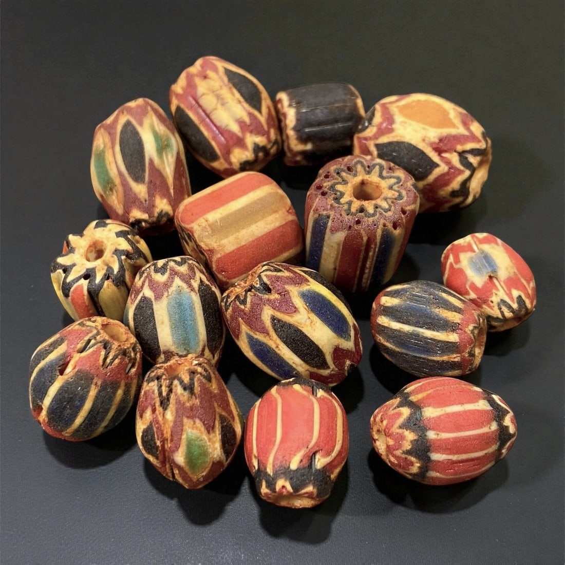 Antique Venetian Chevron Trade Beads, c. 19th Century, 1-1.6cm: This vibrant lot of antique Venetian chevron beads, dating to the 19th century, represents one of the most recognizable and sought-after forms of European glass artistry. Produced in Venice and Murano