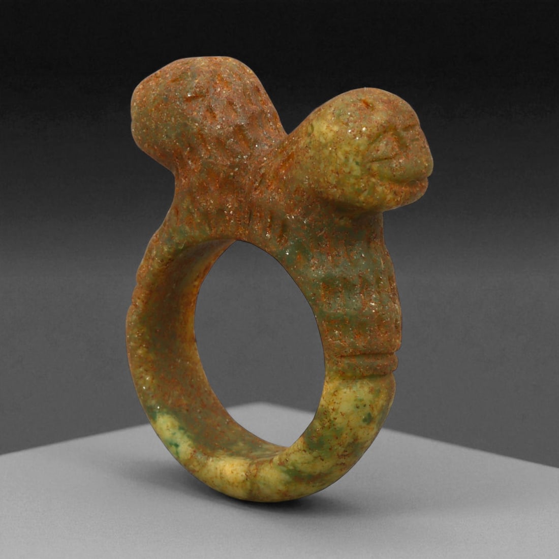 Ancient Parthian Double-Head Lapis Lazuli Ring, c. 2nd-1st Century BCE, 4.1 cm: This remarkable ring, sculpted from vibrant lapis lazuli, represents the artistic refinement and spiritual symbolism of the Parthian Empire. The dual-headed motif, emerging from the shoulders of the r