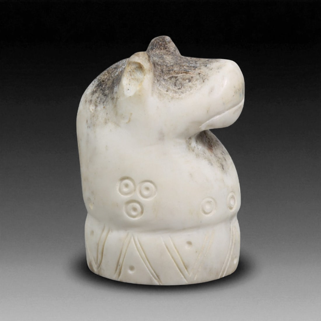 Ancient Near Eastern Carved Bone Animal Effigy, c. 2nd-1st Millennium BCE 48g: This finely carved bone effigy, measuring 6 x 4 cm and weighing 48 grams, represents the stylized head and upper body of an animal, likely a horse or bull, both revered creatures in the Ancient Near E