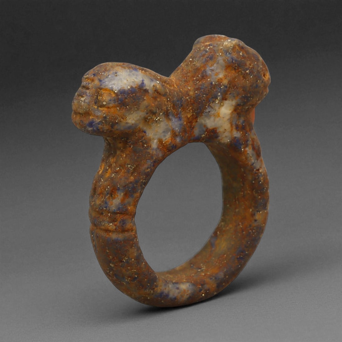 Ancient Parthian Double-Head Lapis Lazuli Ring, c. 2nd-1st Century BCE, 3.4 cm: This remarkable ring, sculpted from vibrant lapis lazuli, represents the artistic refinement and spiritual symbolism of the Parthian Empire. The dual-headed motif, emerging from the shoulders of the r