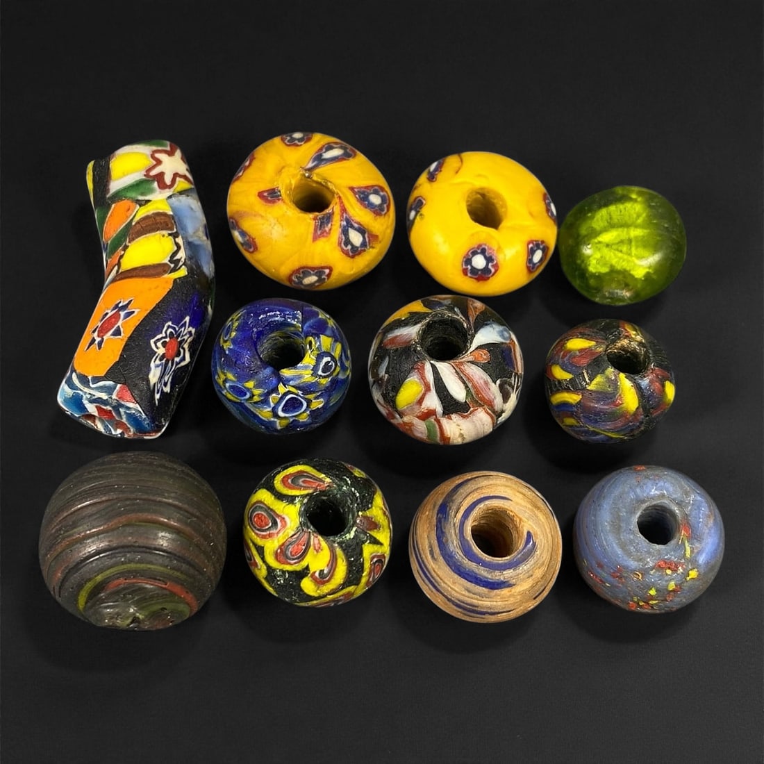Antique Venetian Polychrome Millefiori and Chevron Glass Beads, c. 19th Century, 1.6-3.8cm: This lively assemblage of antique Venetian glass beads, dating from the 19th century, captures the exuberant color and artistry that made Murano glassmakers the undisputed masters of decorative beadwo