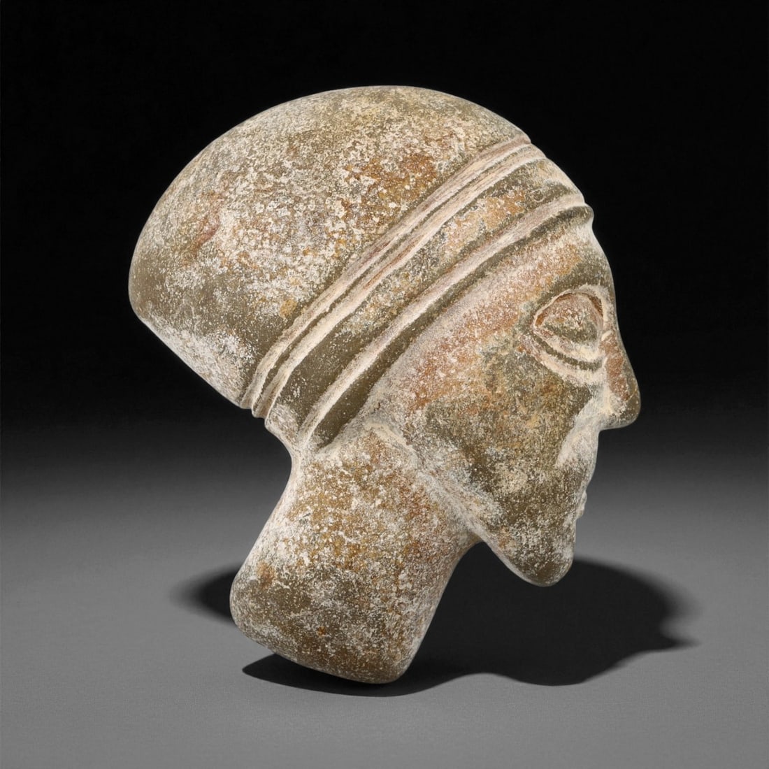 Ancient Old Kingdom Egyptian Carved Steatite Male Head, c. 26th-24th Century BCE, 5.7cm: This elegant steatite head, carved during Egypt's Old Kingdom, reflects the idealized aesthetic that came to define one of the world's earliest monumental artistic traditions. The piece captures the r