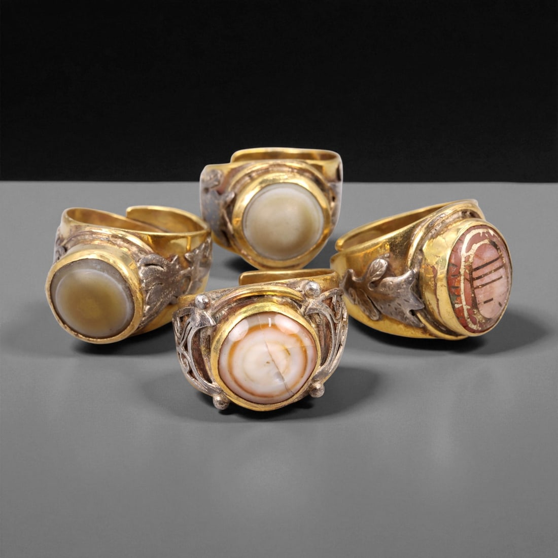 Vintage Himalayan Luk Mik Goat Eye Dzi Silver Gilt Rings Set, c. 20th Century, US 8.75-12.25: This set of vintage Himalayan Luk Mik goat eye Dzi rings reflects a long-standing tradition in the mountain regions of Tibet, Nepal, and Bhutan, where protective stones and symbolic motifs have been w