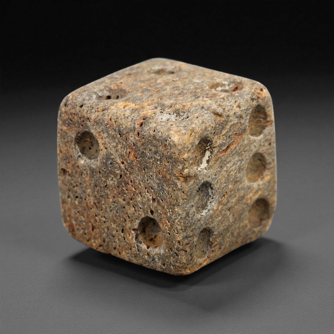 Ancient Roman Gaming Bone Dice, c. 1st-3rd Century CE 1.4cm: This ancient Roman gaming die, carved from dense bone, reflects the enduring spirit of play and strategy within Roman daily life. Dice like this were used in taverns, private homes, and military encam