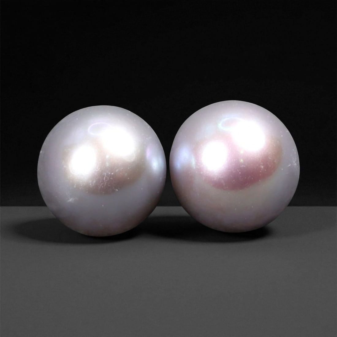4.17 Carats Soft Pink Freshwater Pearl Pair - Natural Chinese Origin - 6.5 mm: This graceful pair of freshwater pearls glows with a soft pink overtone and smooth nacre that speaks to their natural elegance. Their rounded form and subtle mirror-like luster highlight the pearls' o