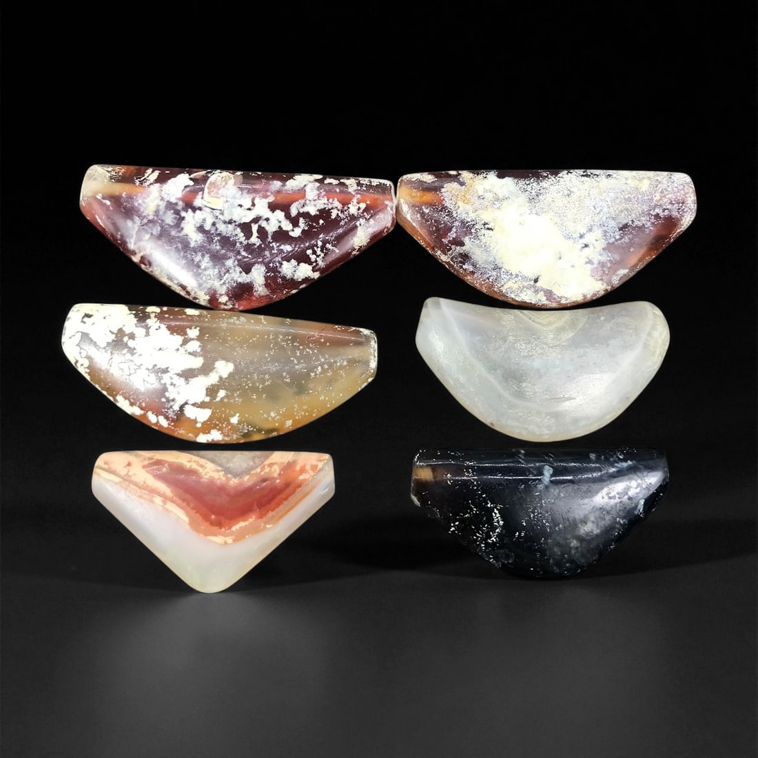 Ancient Persian Carnelian Bow Amulet Beads c. 1st Mill BCE 3.4-4.5cm: These ancient Persian bow amulets reflect a revered talismanic tradition, shaped during the 1st millennium BCE when carnelian and agate were carefully worked into protective forms. Their distinct cres