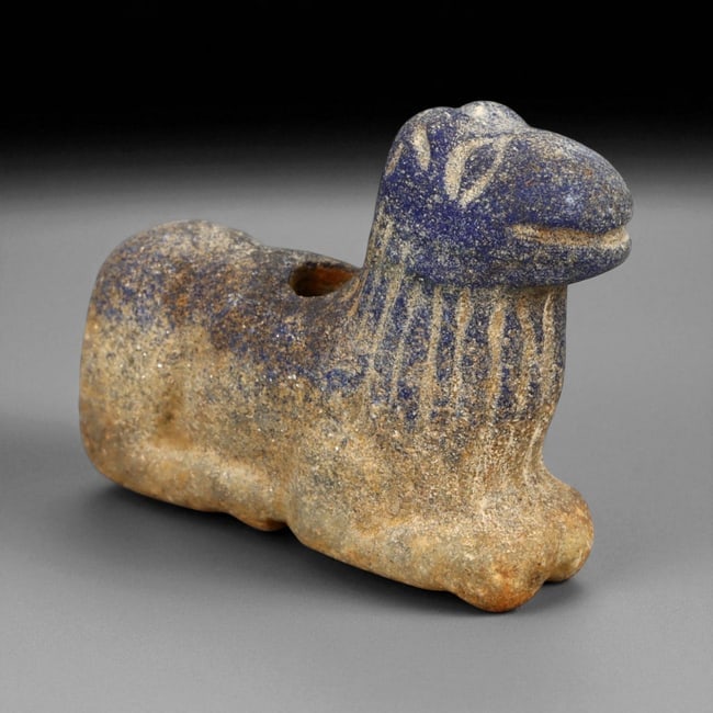 Ancient Bactrian Lapis Lazuli Lion Effigy, c. 2nd-1st Millennium BCE, 5.5cm: This striking lapis lazuli effigy, carved in the form of a recumbent lion, originates from ancient Bactria, circa 2nd-1st millennium BCE. Sculpted from vibrant blue lapis lazuli streaked with veins of