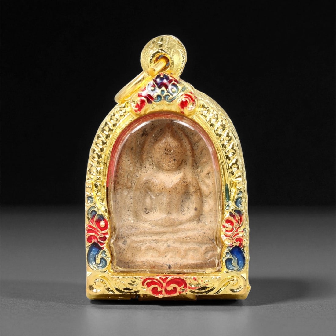 Gilt Buddhist Amulet in Ornate Gold-Tone Frame, Thai Temple Style , 4.5cm: This beautifully crafted gilt Buddhist amulet is enclosed within an intricately designed gold-tone frame, combining sacred symbolism with refined artistry. The detailed relief and lustrous finish refl