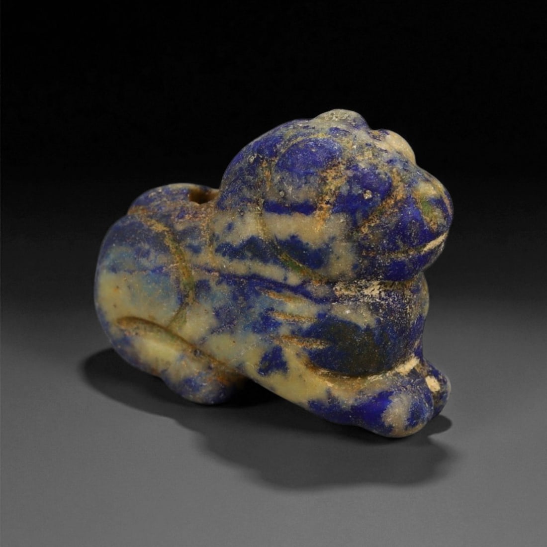 Ancient Bactrian Lapis Lazuli Feline Amulet, c. 3rd-2nd Millennium BCE, 2.5 cm, 4EK: This captivating lapis lazuli feline amulet originates from the ancient Bactrian civilization of Central Asia, dating to the 3rd-2nd millennium BCE. Carved from a single piece of fine lapis, it depict