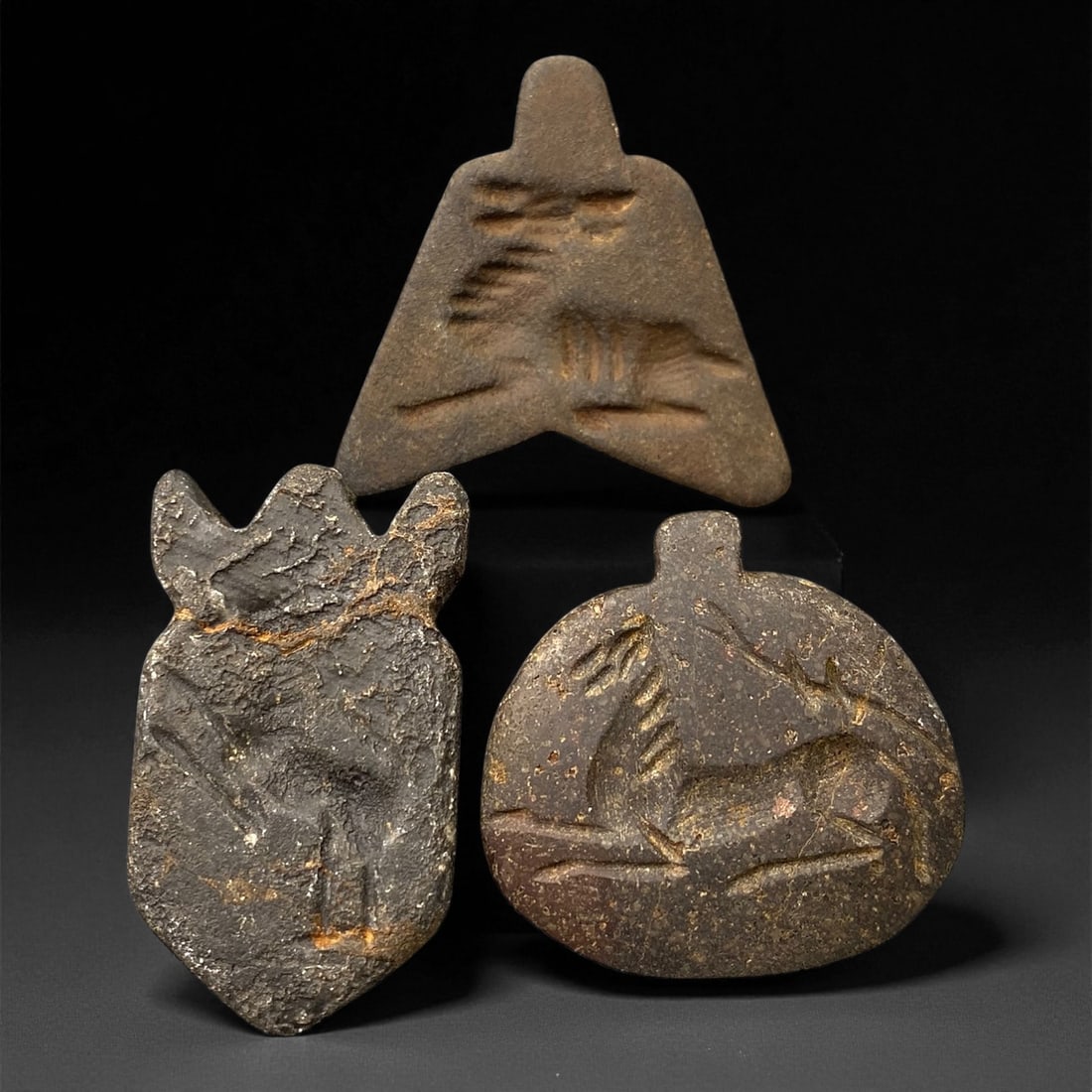Ancient Neo-Assyrian Steatite Amulet Group, c. 8th-7th Century BCE, 3.5-4.2cm, 44EK: This rare assemblage of three carved steatite amulets originates from the Neo-Assyrian period, a pinnacle of Mesopotamian artistry renowned for its intricate symbolism and protective talismans. Each p