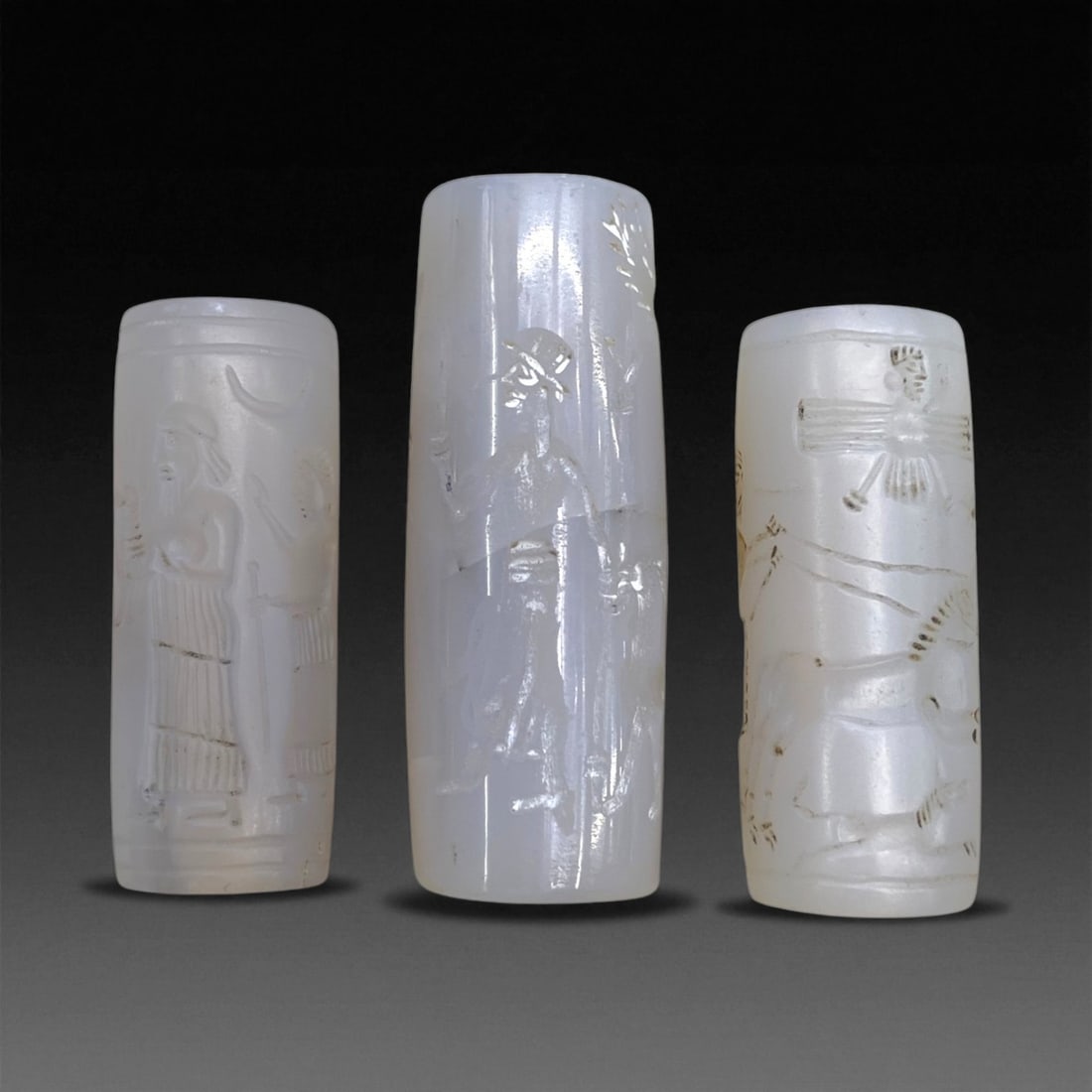 Ancient Neo-Assyrian Chalcedony Cylinder Seals (Set of 3), c. 9th-7th Century BCE, 5cm, 62g, 45AA: This distinguished trio of finely carved chalcedony cylinder seals dates to the Neo-Assyrian Empire (c. 9th-7th century BCE), a period renowned for its powerful imperial iconography and exceptional cr