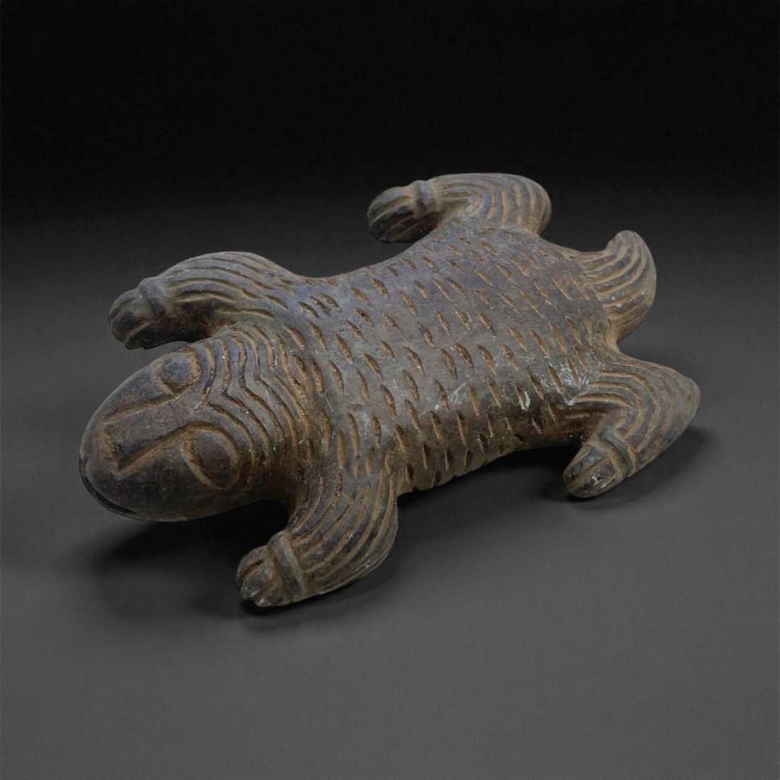 Ancient Colima Zoomorphic Effigy of a Crocodile, c. 200 BCE-200 CE, 11cm, 177g, 55AA: This compelling zoomorphic effigy, likely representing a crocodile or lizard, originates from the Colima culture of ancient West Mexico and dates to the Late Preclassic to Early Classic period, c. 200