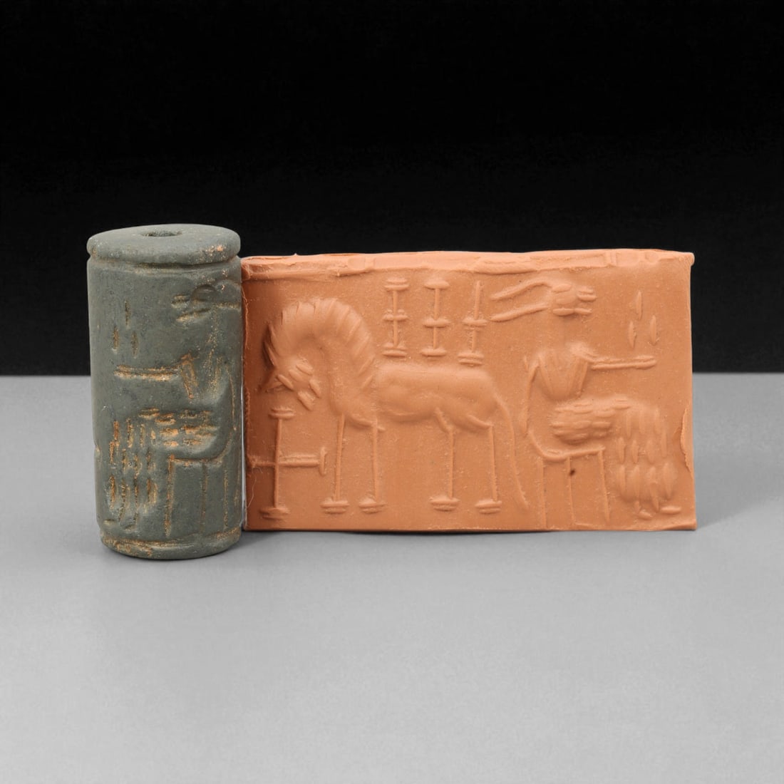 Ancient Near Eastern Stone Cylinder Seal of Mythic Motifs, c. 2nd-1st Millennium BCE, 4cm, 74K: A striking relic from the dawn of civilization, this ancient Mesopotamian cylinder seal dates to the 2nd-1st millennium BCE - a period when art, writing, and ritual became inseparable expressions of c