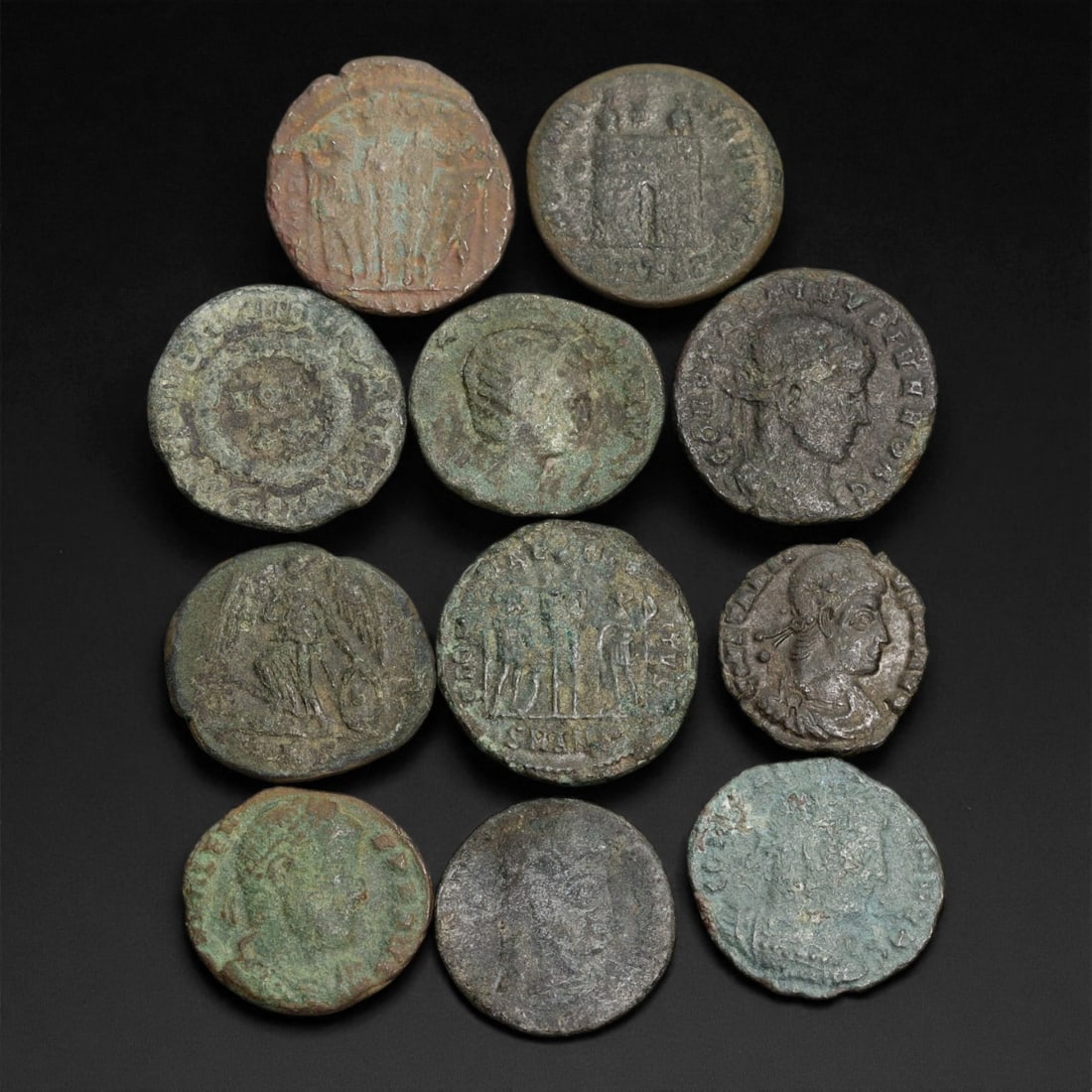 Ancient Roman Bronze AE Coins, c. 3rd-4th Century CE, 1.4-1.8 cm, 26EN: This collection of eleven small bronze AE coins originates from the later Roman Empire, dating between the 3rd and 4th centuries CE - a period marked by political transformation, imperial division, an