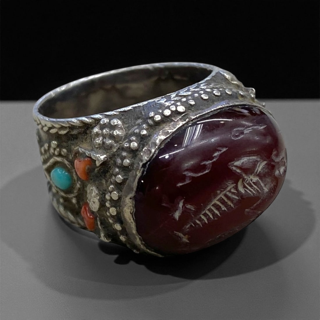 Antique Indo-Tibetan Silver Carnelian Intaglio Ring, c. 19th Century, US 8.5 15g, 84BB: This remarkable antique ring reflects the refined yet rugged artistry of Indo-Tibetan silversmiths of the 19th century, who merged Central Asian symbolism with Himalayan spiritual motifs. The piece ce
