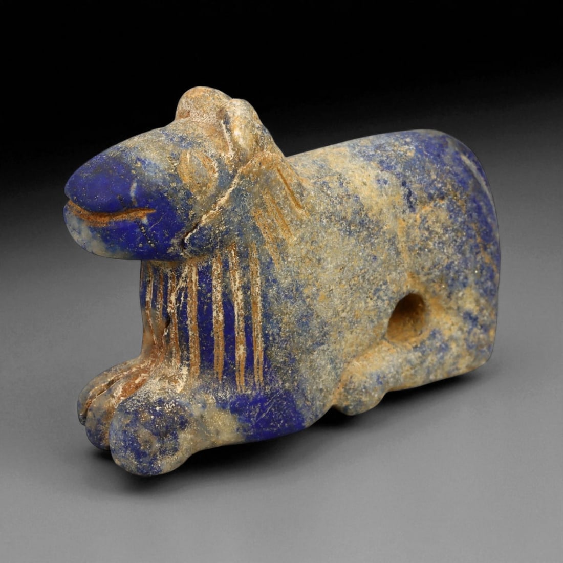 Ancient Bactrian Lapis Lazuli Lion Effigy, c. 2nd-1st Millennium BCE, 5cm, 49DP: This striking lapis lazuli effigy, carved in the form of a recumbent lion, originates from ancient Bactria, circa 2nd-1st millennium BCE. Sculpted from vibrant blue lapis lazuli streaked with veins of
