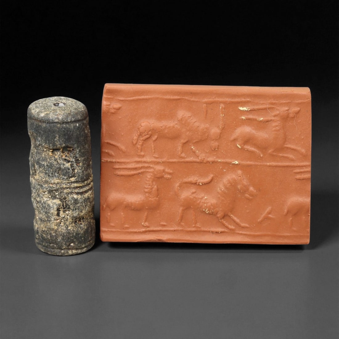Ancient Mesopotamian Cylinder Seal of Divine Favor, c. 2nd-1st Millennium BCE, 4.6cm, 74EG: A striking relic from the dawn of civilization, this ancient Mesopotamian cylinder seal dates to the 2nd-1st millennium BCE - a period when art, writing, and ritual became inseparable expressions of c