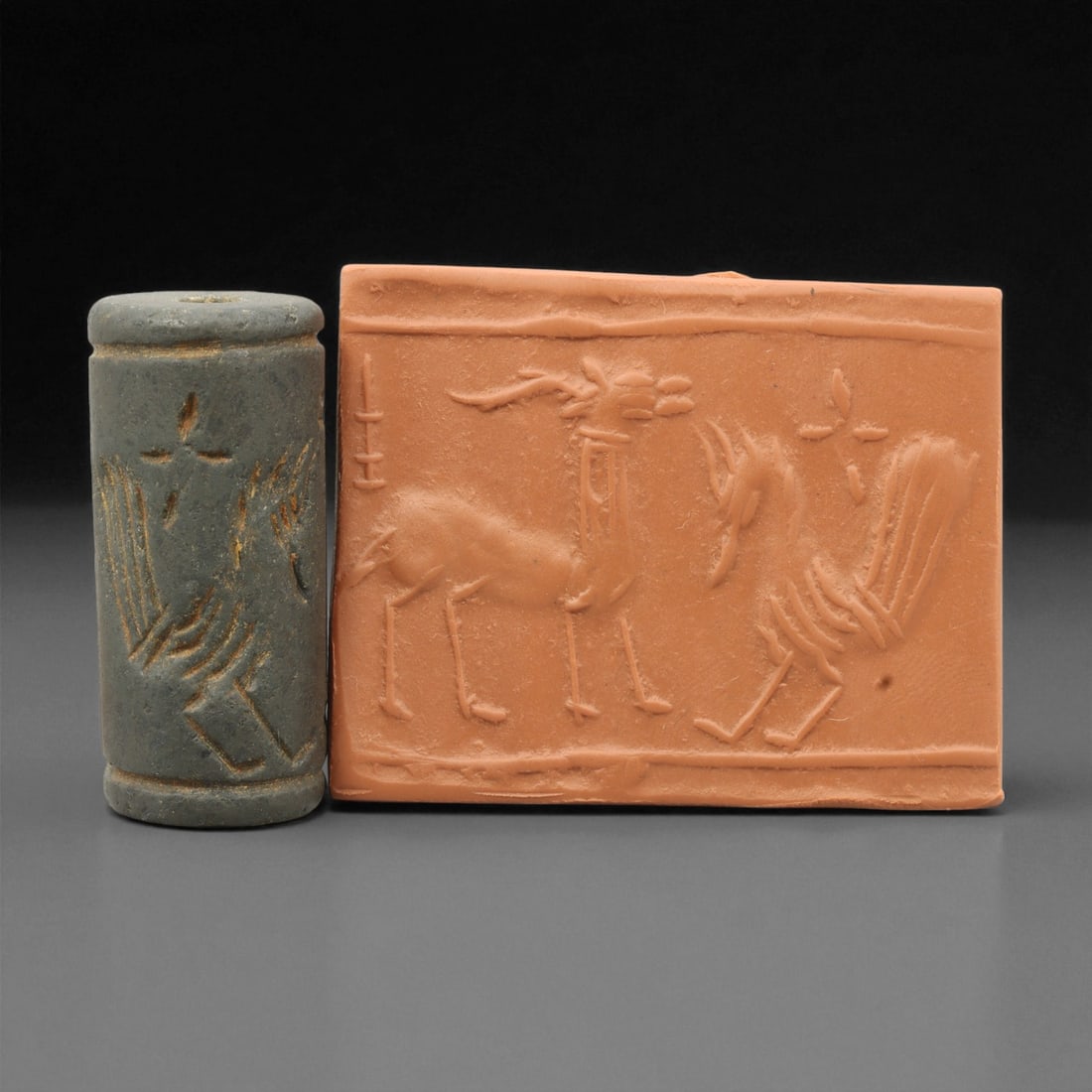 Ancient Mesopotamian Akkadian Steatite Cylinder Seal, c. 2300-2100 BCE, 4.1cm, 83EL: Carved from fine dark steatite, this ancient Akkadian cylinder seal dates to the late 3rd millennium BCE, a period when Mesopotamian artisans perfected the art of miniature relief engraving. Each seal