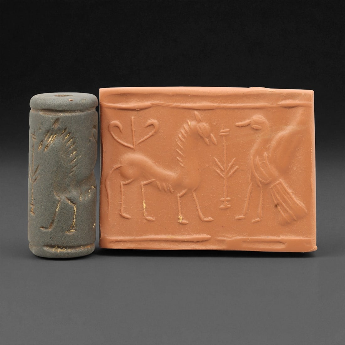 Ancient Mesopotamian Akkadian Steatite Cylinder Seal, c. 2300-2100 BCE, 4.1cm, 32EV: Carved from fine dark steatite, this ancient Akkadian cylinder seal dates to the late 3rd millennium BCE, a period when Mesopotamian artisans perfected the art of miniature relief engraving. Each seal