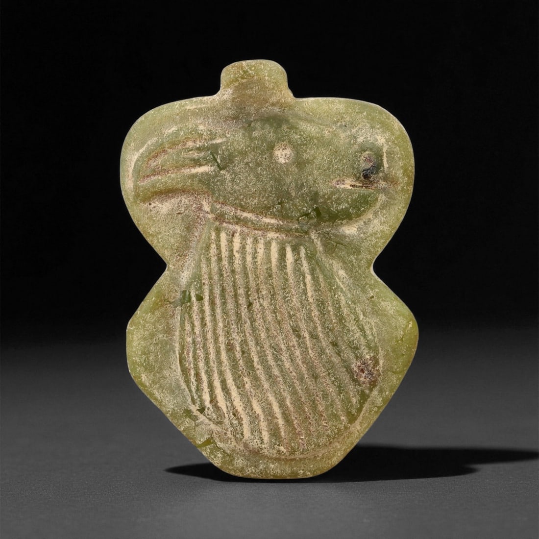 Ancient Mesopotamian Serpentine Feline Amulet, c. Neo-Assyrian Period, 4.5cm, 99ES: This finely carved serpentine amulet originates from Mesopotamia's Neo-Assyrian period (circa 9th-7th century BCE), a time when protective talismans played a vital role in daily life and spiritual bel